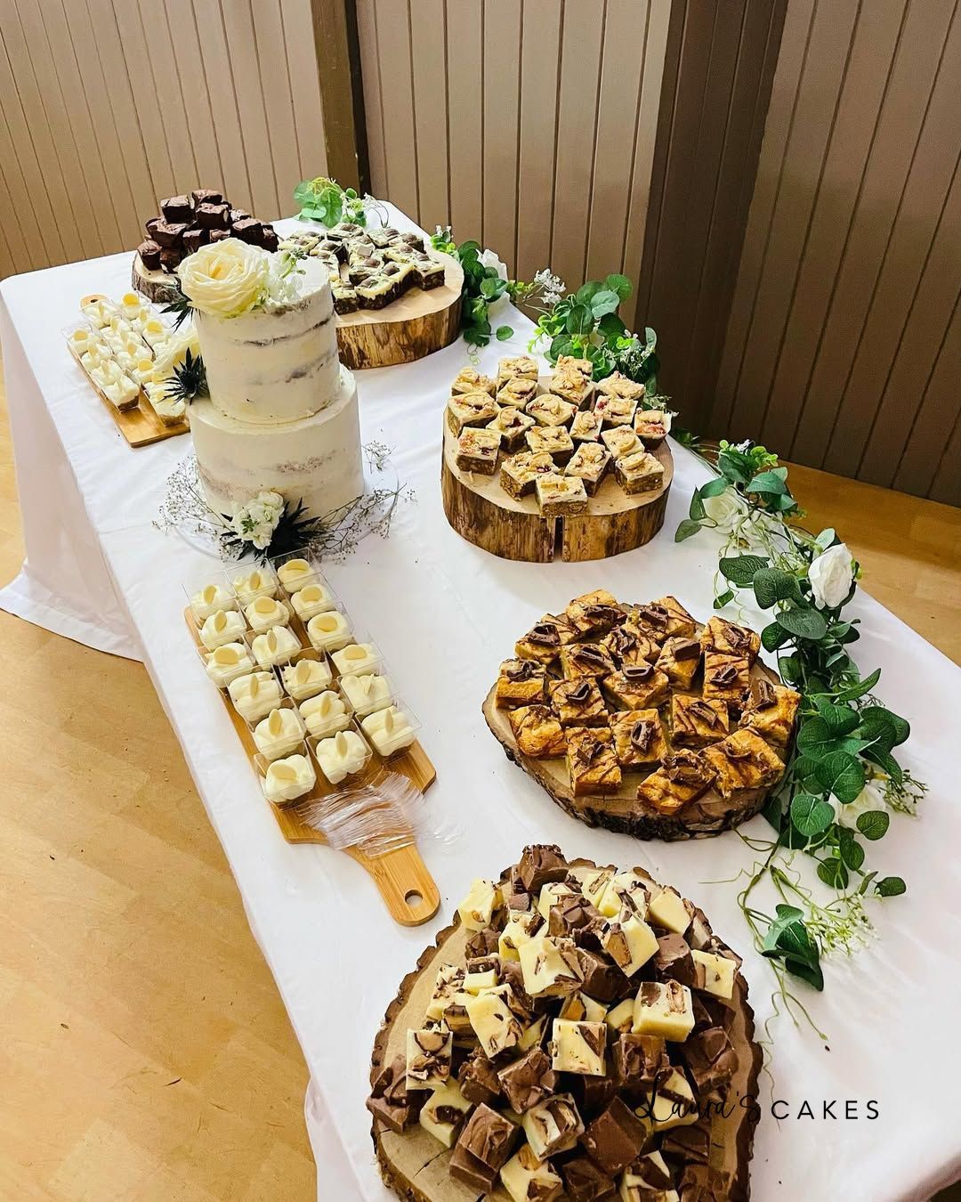 1-a-table-topped-with-desserts-and-a-cake