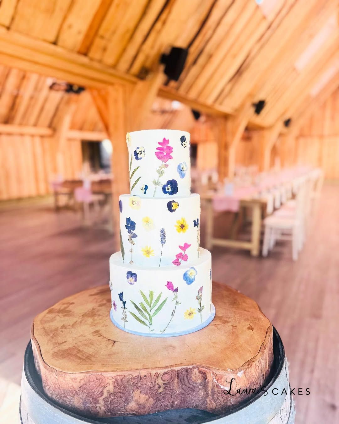 1-a-white-cake-with-colorful-flowers-on-top