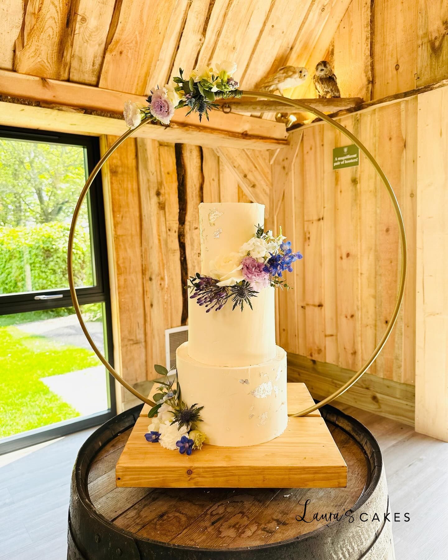 1-a-white-cake-with-purple-flowers-on-top