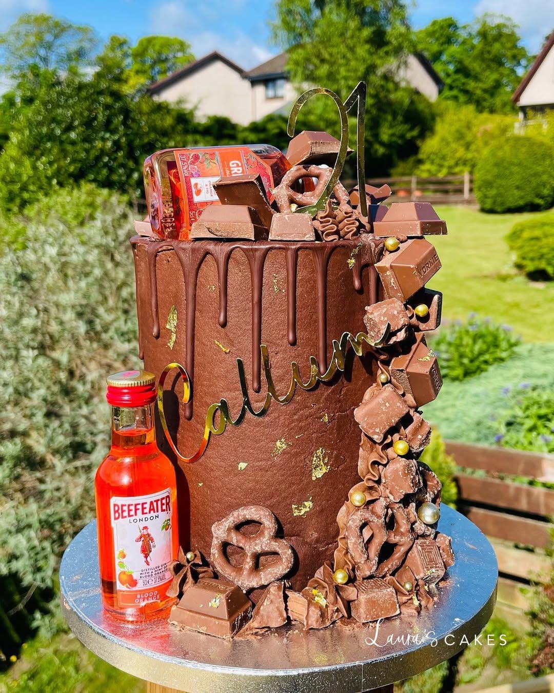 Celebration cake: A chocolate covered cake with a bottle of beer