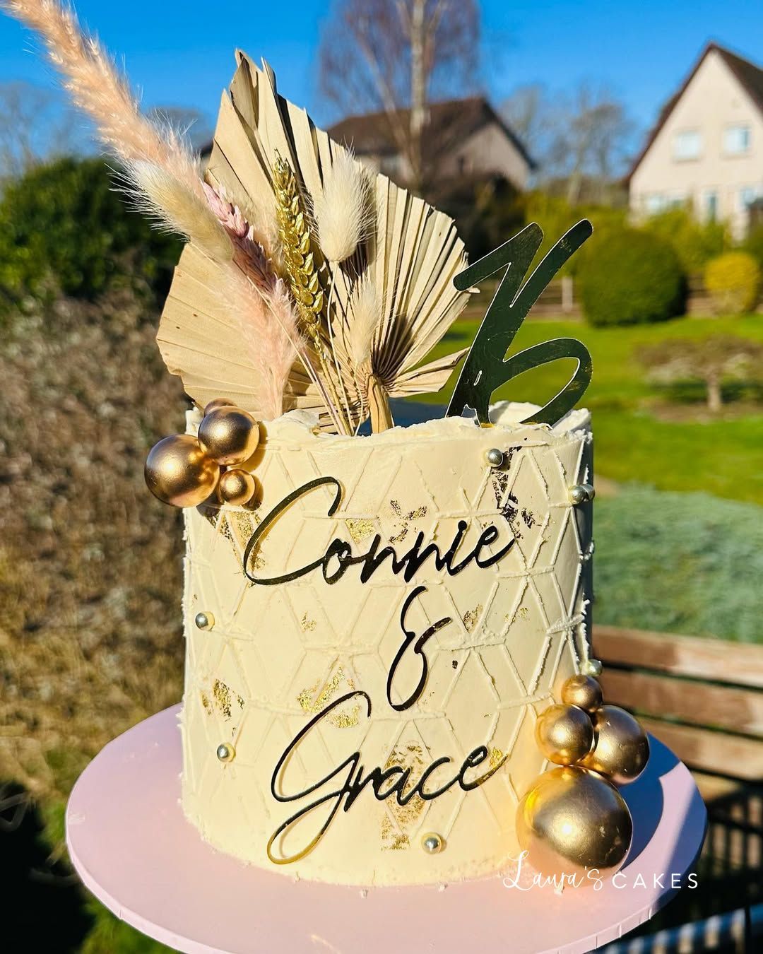 Celebration cake: A gold and white design on top