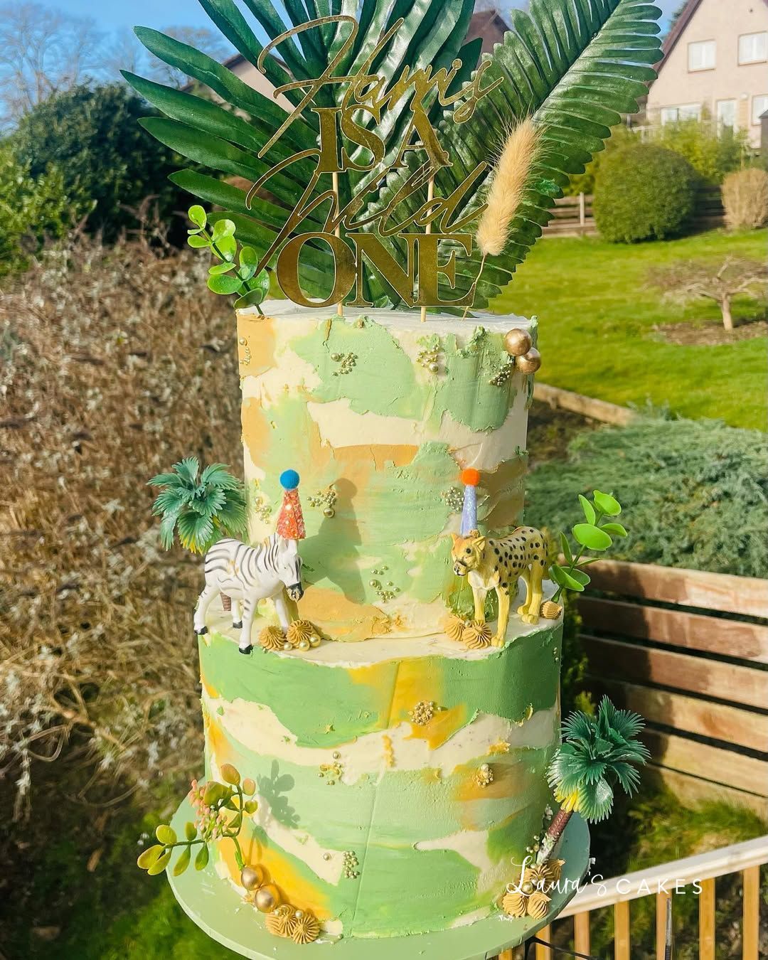 Celebration cake: A green and yellow design on it