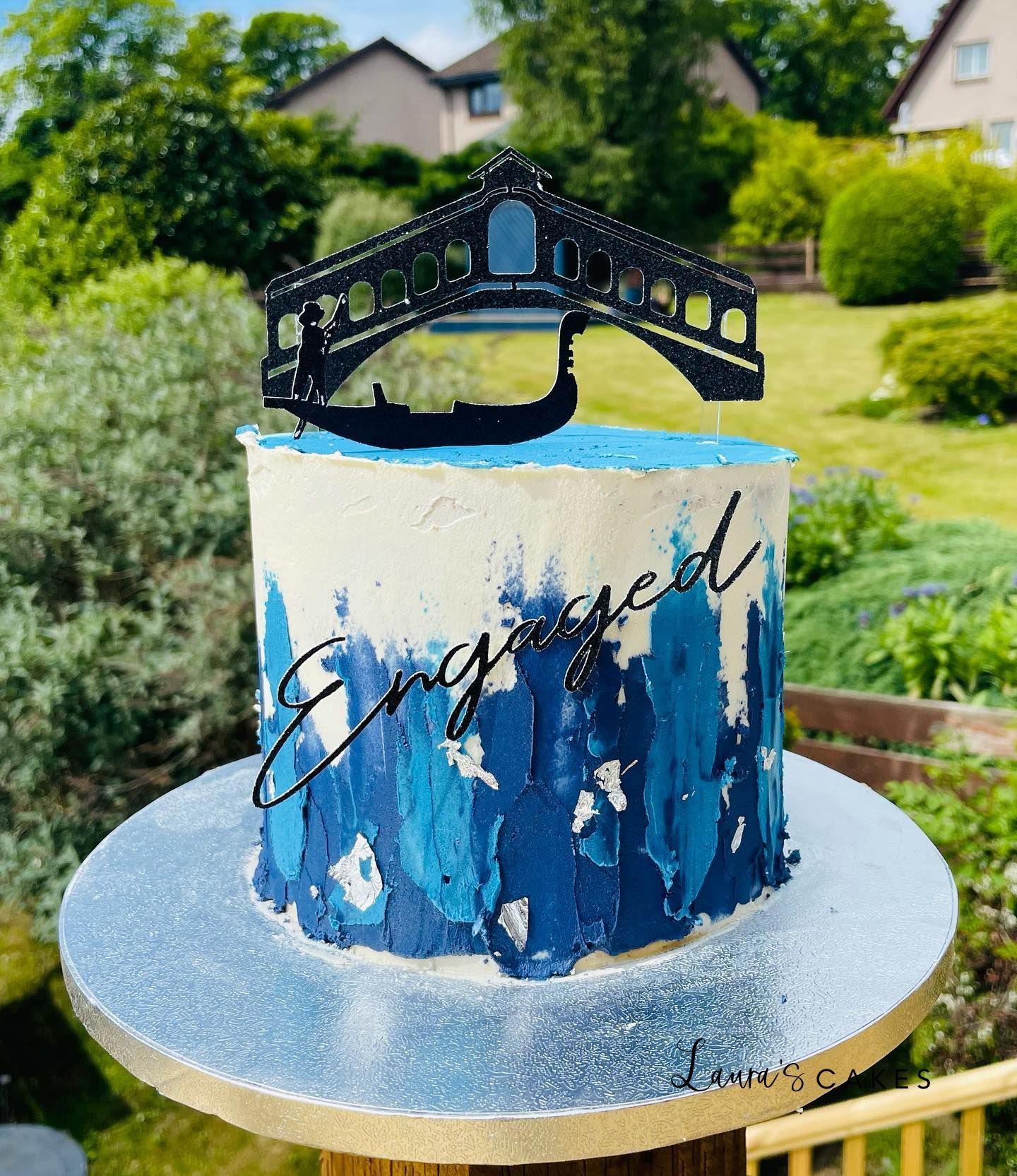 Celebration cake: A gun on top of it