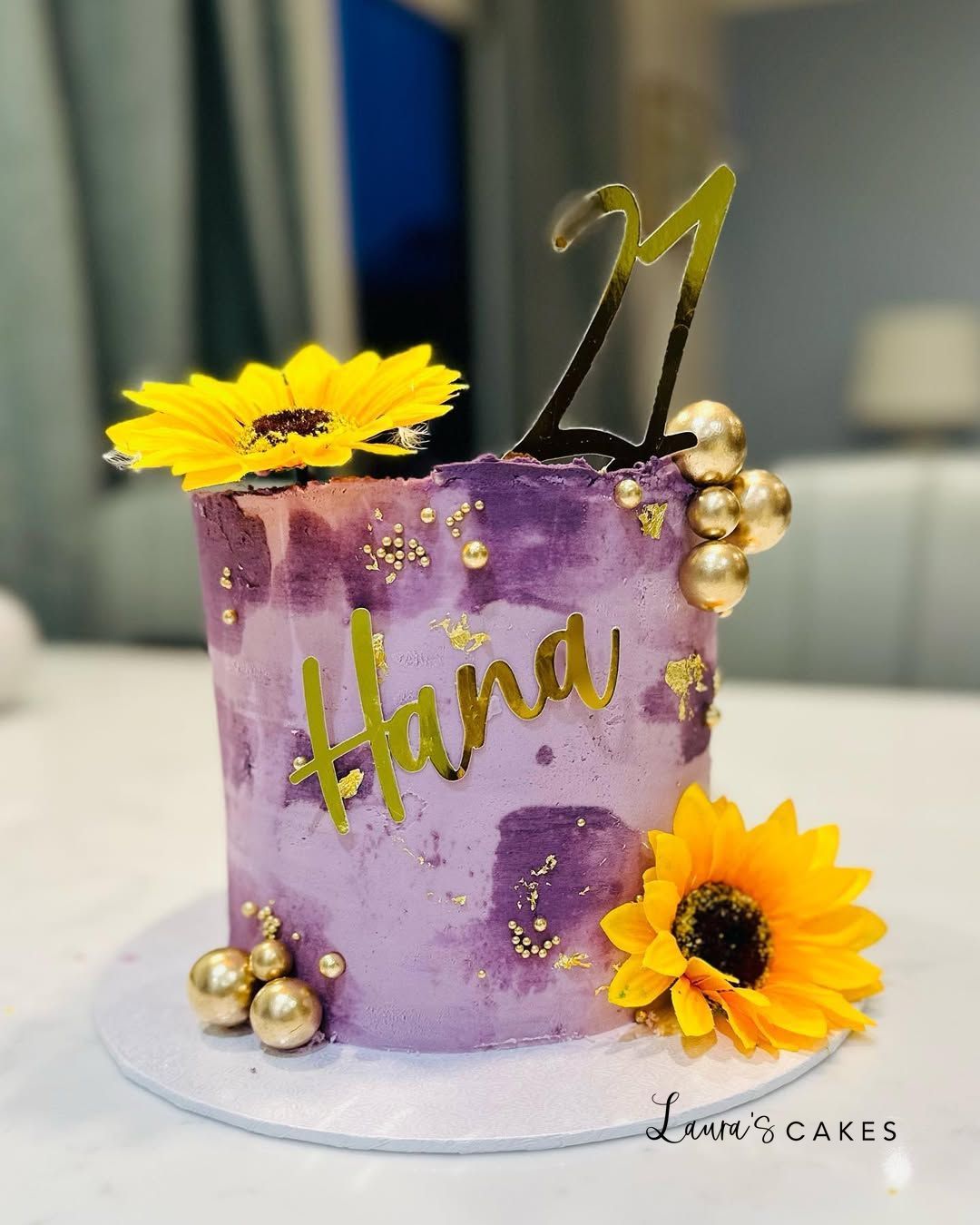Celebration cake: A purple cake with gold and purple frosting
