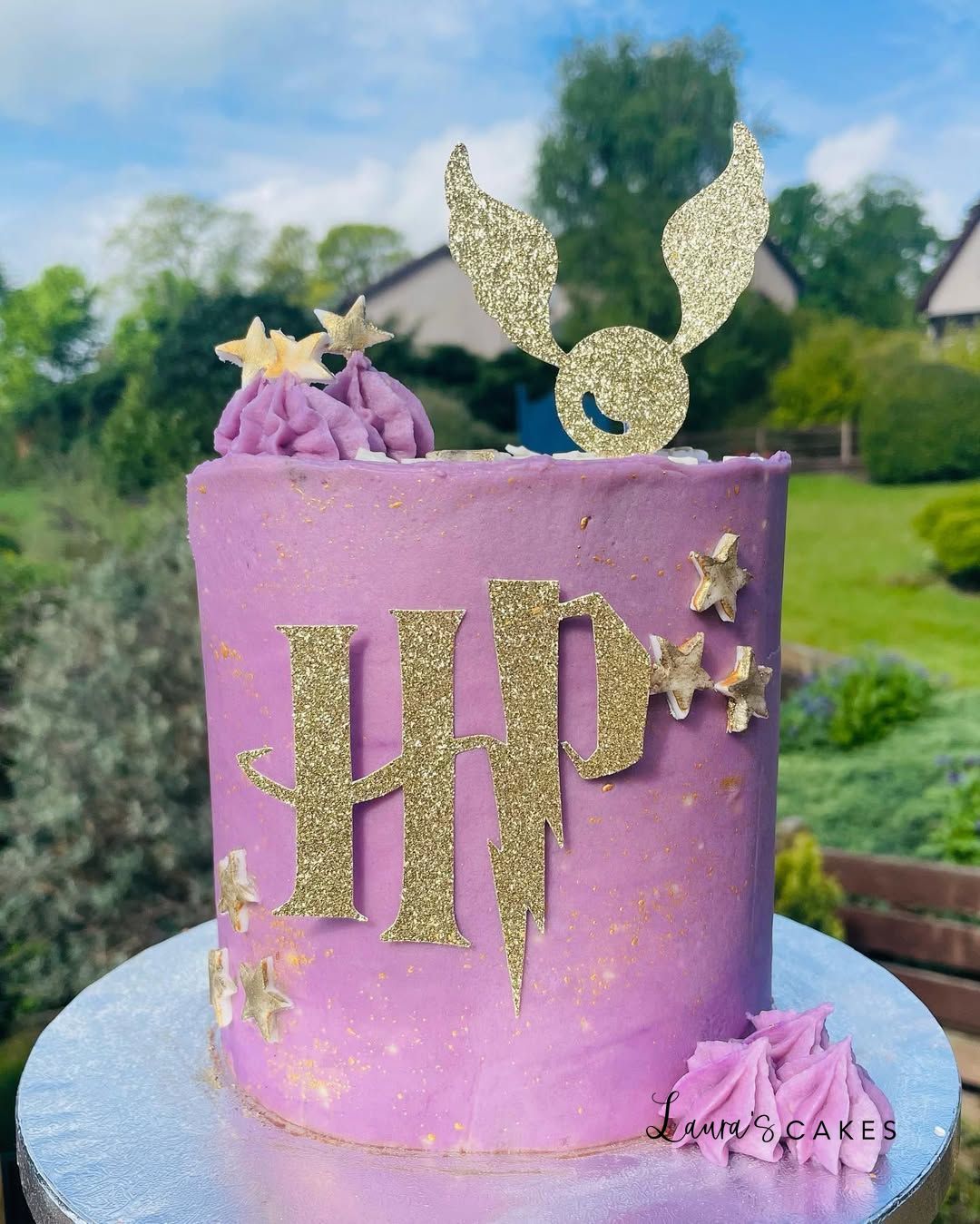Celebration cake: A purple cake with gold glitter and a mermaid tail