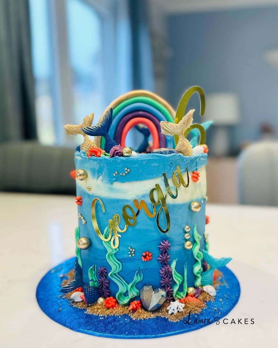 Celebration cake: A rainbow and sea creatures on it
