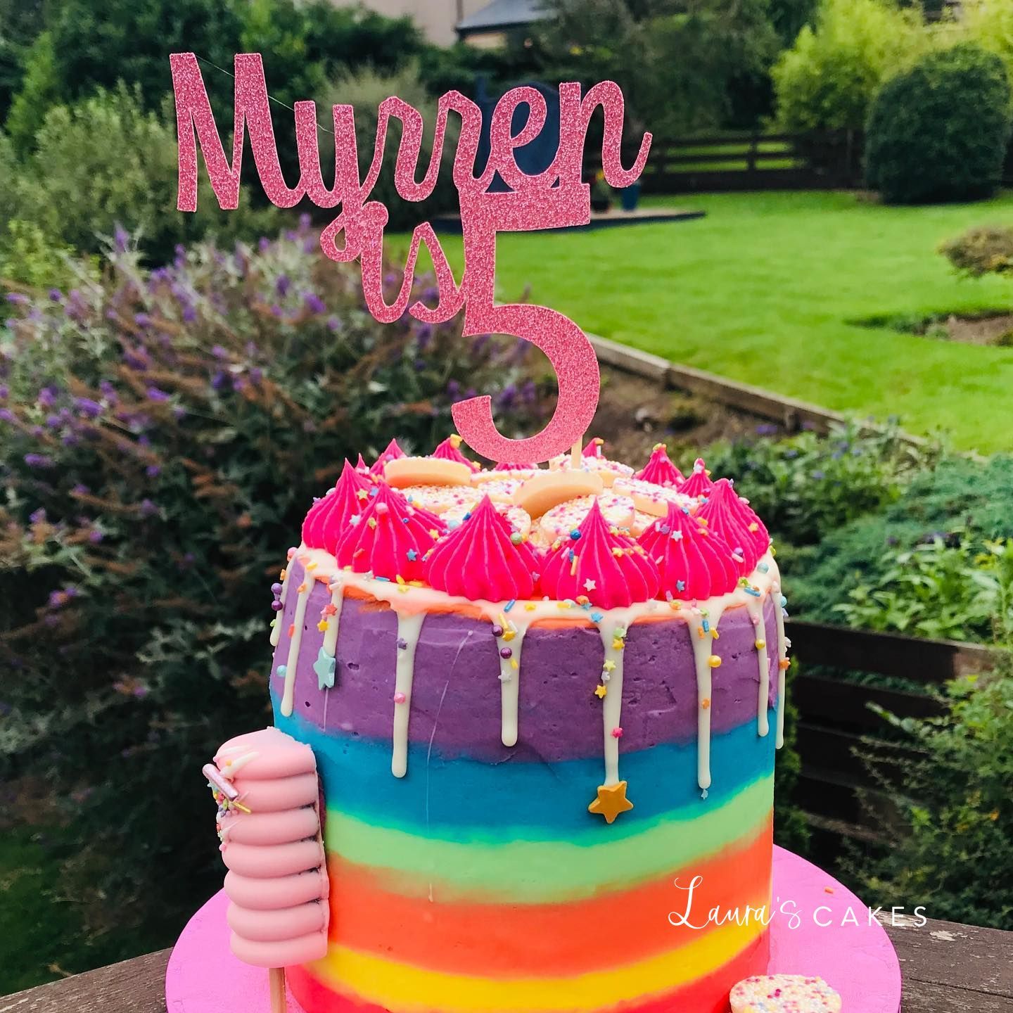 Celebration cake: A rainbow cake topper and a rainbow cake topper