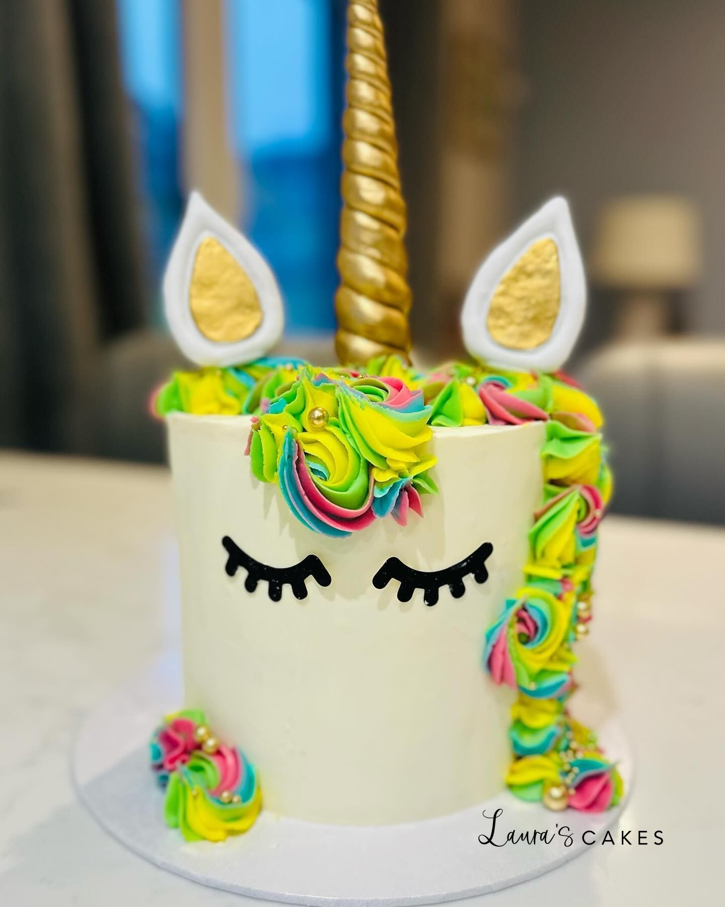 Celebration cake: A unicorn cake with a rainbow colored mane on top