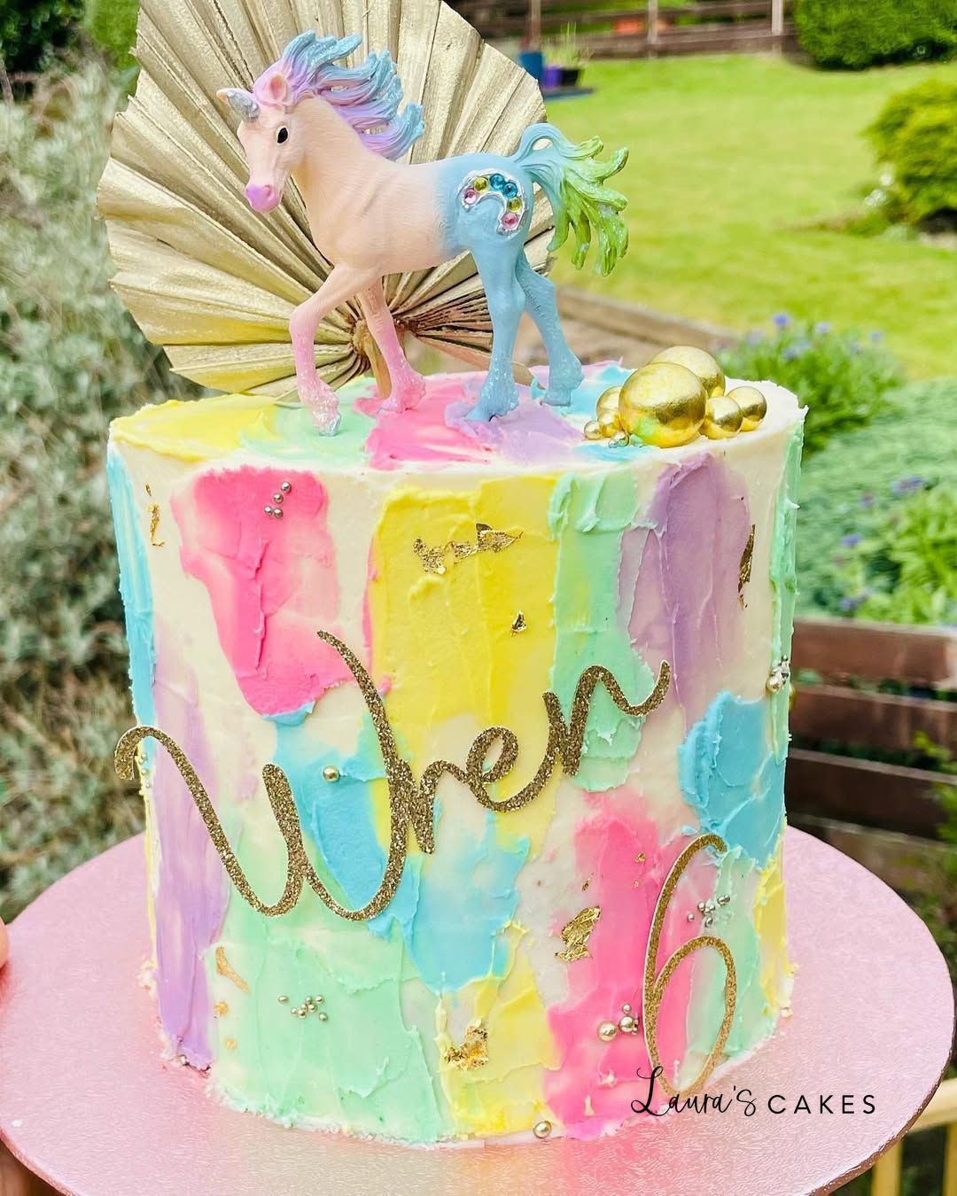 Celebration cake: A unicorn on top of it
