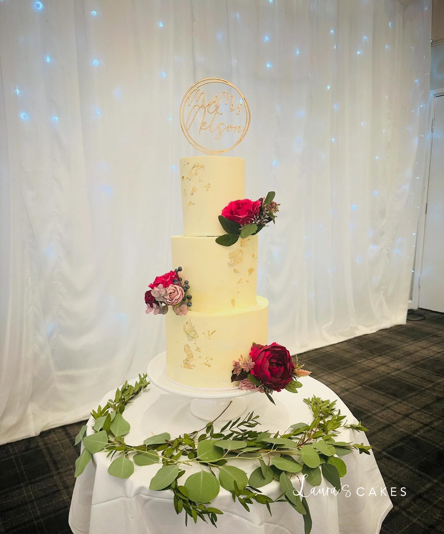 Wedding cake: A white cake with flowers
