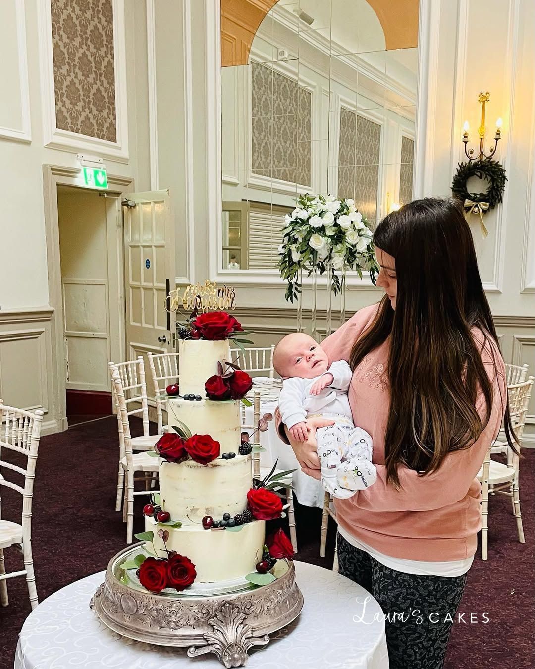 Wedding cake: A woman holding a baby in her arms