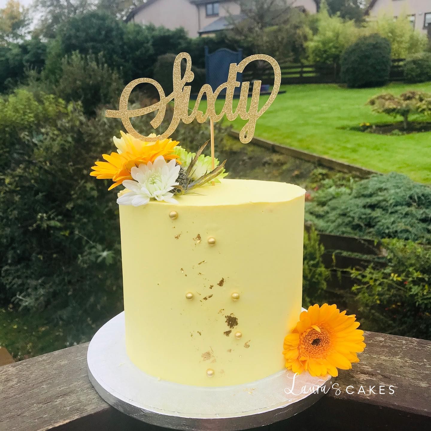 Celebration cake: A yellow cake with a name on top