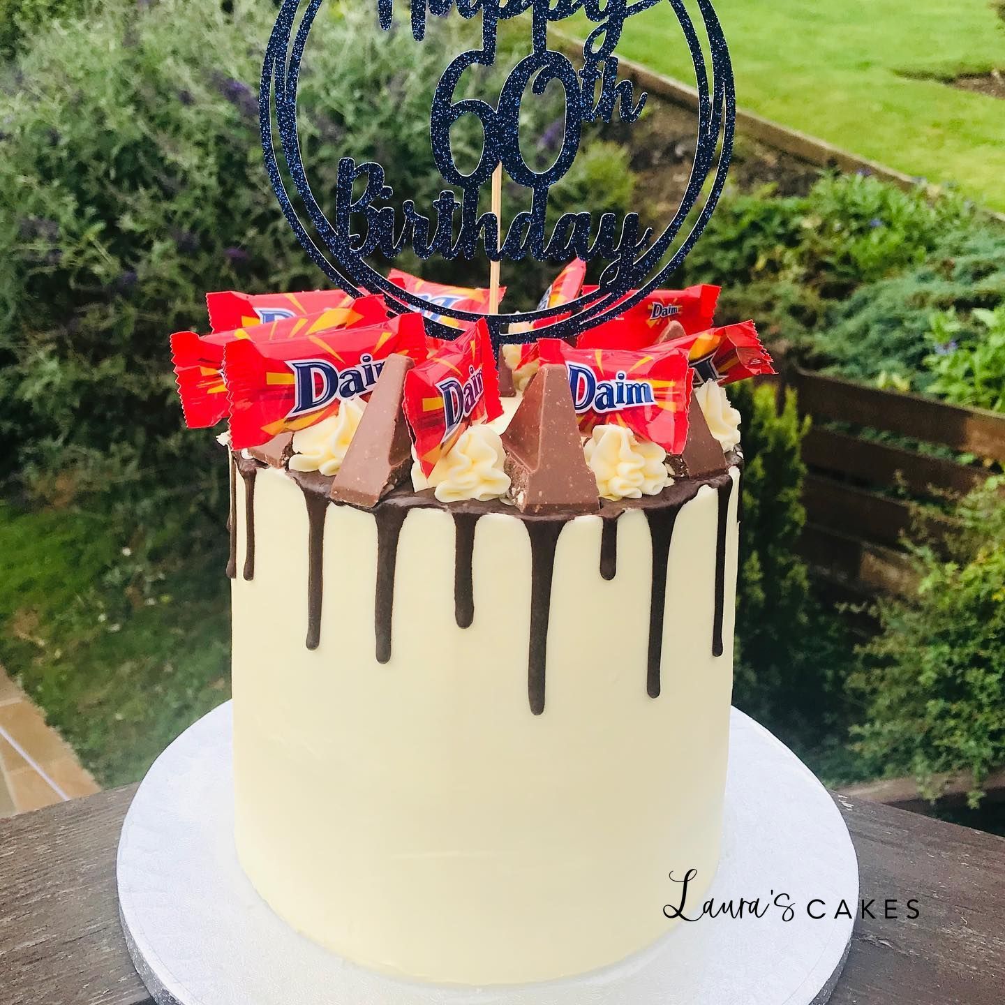 Celebration cake: Chocolate drips and a cake topper