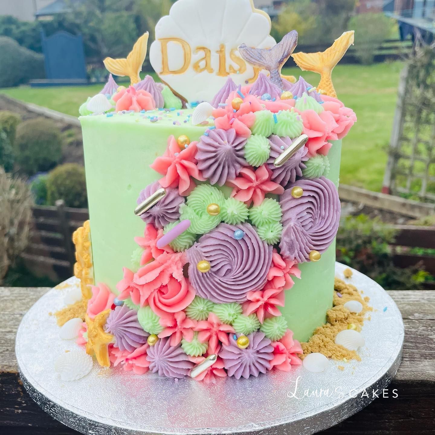 Celebration cake: Flowers and butterflies on top