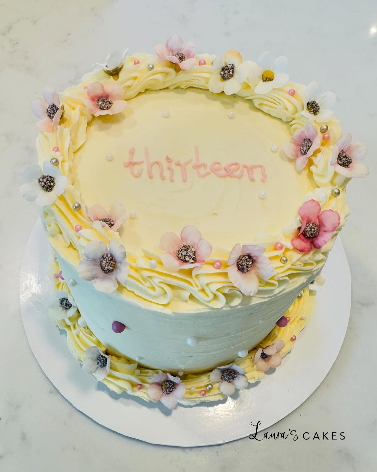 Celebration cake: Flowers on top of it