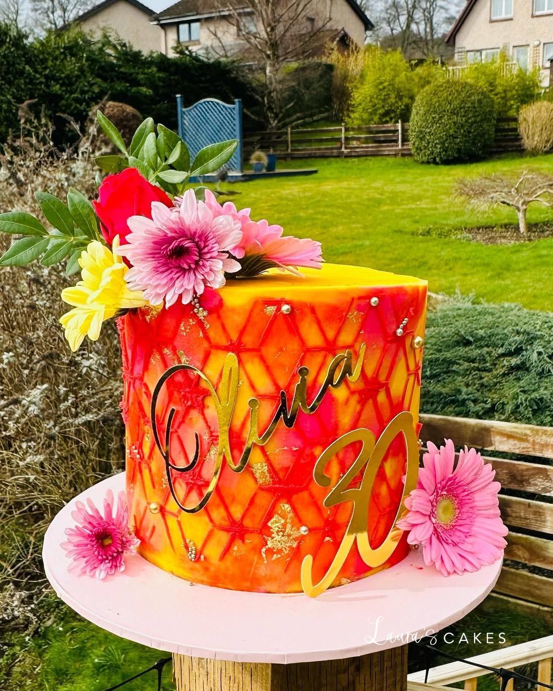 Celebration cake: Flowers on top of it