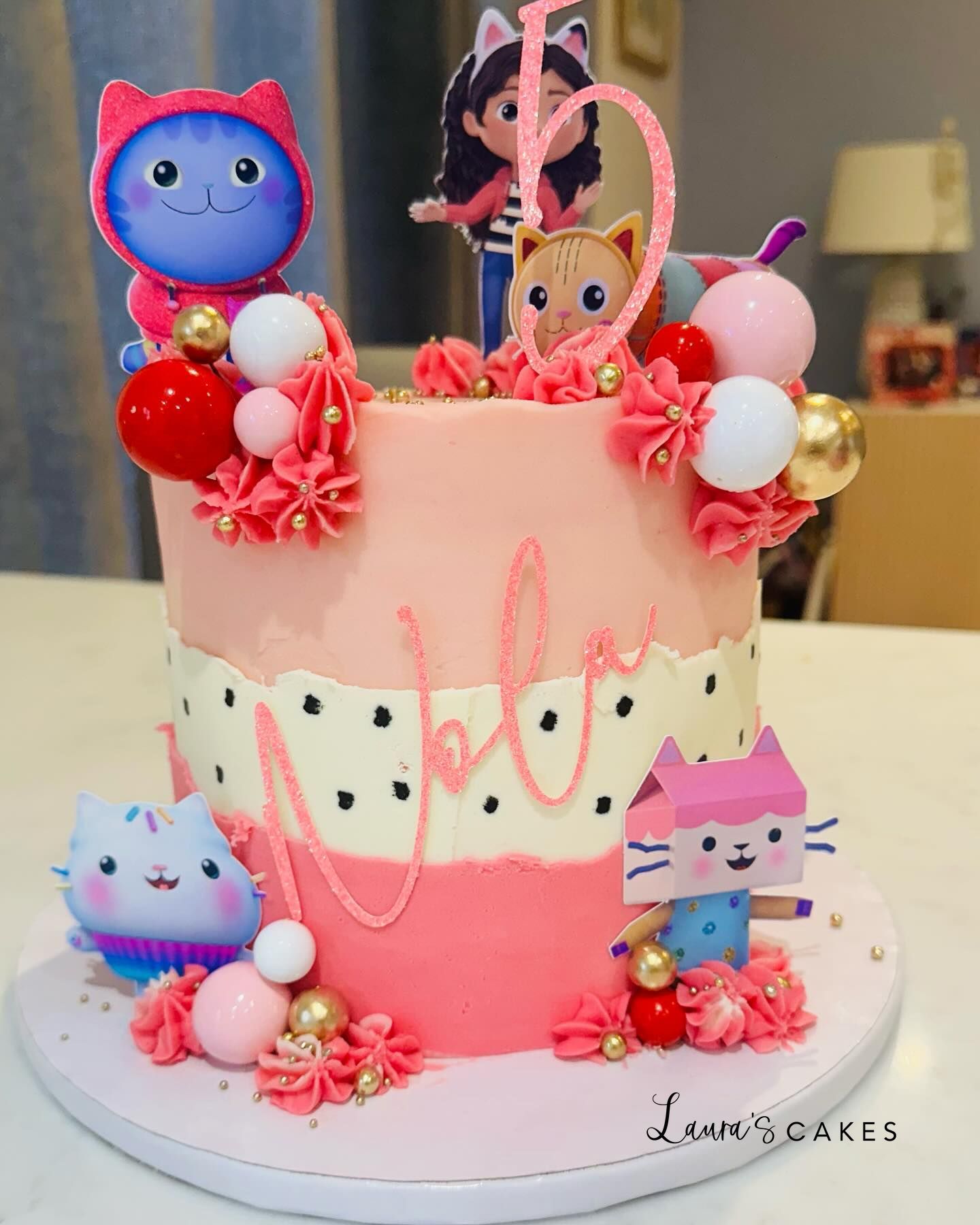 Celebration cake: Pink frosting and pink decorations