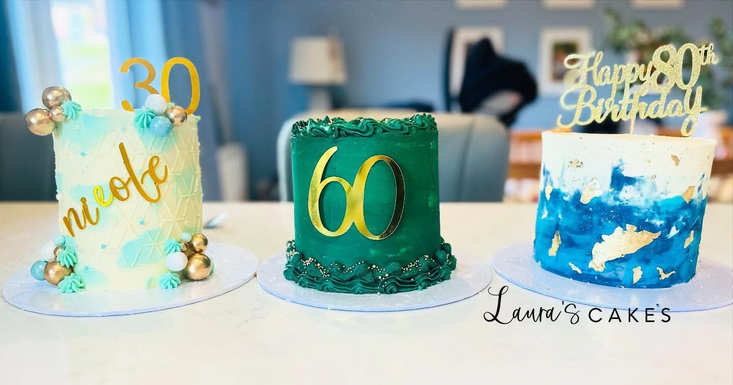 Celebration cake: Three cakes with gold and green frosting on them