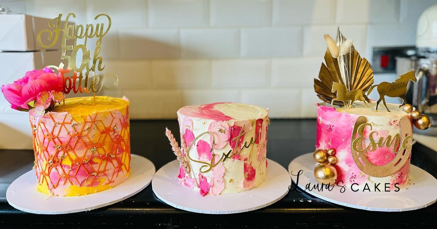 Celebration cake: Three cakes with gold and pink decorations on top