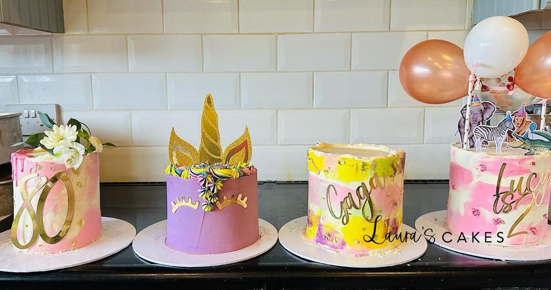 Celebration cake: Three cakes with pink and yellow frosting on top