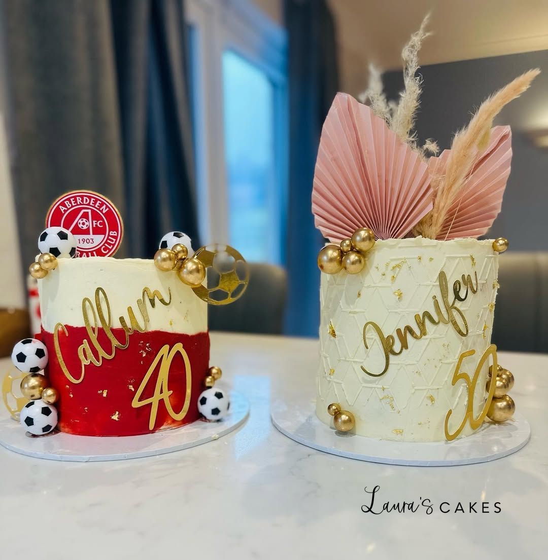 Celebration cake: Two cakes with gold and red decorations on them