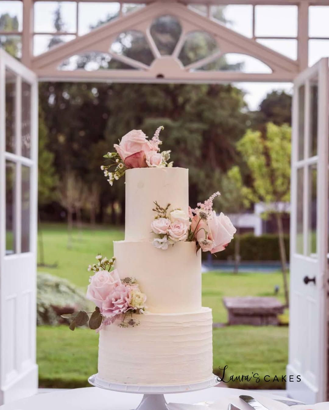 2 tier wedding cake in a conservatory
